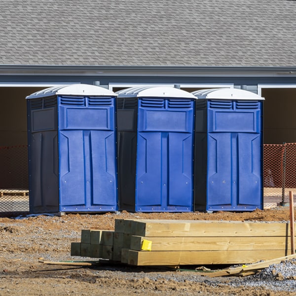 what is the cost difference between standard and deluxe portable restroom rentals in West Poland